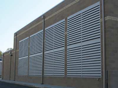 Photo E: Central utility plant with fixed-blade acoustic louvers.