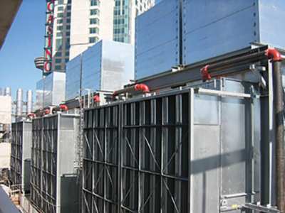 Photo D: Induced-draft cooling towers with rectangular intake and discharge silencers.