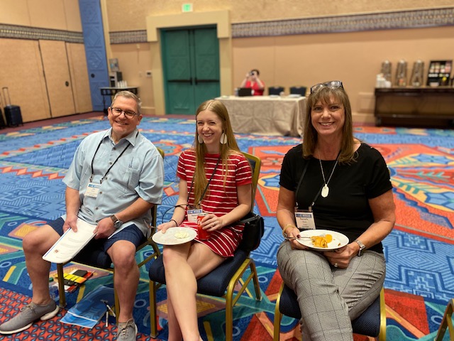 (From left) 2021-2022 AMCA President Jim Meats, PE; Rebecca Ray; and Rachelle Meats enjoy refreshments between the Disney Institute-presented keynote sessions on leadership excellence and employee engagement the morning of March 3.